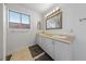 Bright bathroom with double sinks, a large mirror, and vanity at 823 Schooner Dr, Henderson, NV 89015