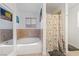 Bright bathroom featuring a soaking tub and shower with floral curtain at 823 Schooner Dr, Henderson, NV 89015