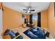 Relaxing bedroom featuring hardwood floors, natural light and a lounge area at 823 Schooner Dr, Henderson, NV 89015