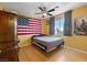 A spacious bedroom with hardwood floors, natural light and a ceiling fan at 823 Schooner Dr, Henderson, NV 89015