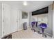 Bright entryway featuring tile floors, a window with custom blinds, and modern decor at 823 Schooner Dr, Henderson, NV 89015
