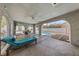 Covered patio with a ceiling fan, blue lounge chair, and view of the outdoor pool at 823 Schooner Dr, Henderson, NV 89015