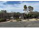 Community pool surrounded by lush landscaping and secured by a gate at 823 Schooner Dr, Henderson, NV 89015