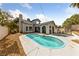 Backyard with pool and attached spa in a landscaped yard at 823 Schooner Dr, Henderson, NV 89015