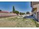 Spacious backyard with a refreshing pool, patio, and privacy wall at 864 E Eldorado Ln, Las Vegas, NV 89123