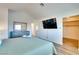 Bright bedroom with large bed, walk-in closet and ensuite bathroom at 864 E Eldorado Ln, Las Vegas, NV 89123
