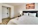 Bright bedroom with a queen-size bed, closet with built-ins, soft bedding, and modern decor at 864 E Eldorado Ln, Las Vegas, NV 89123