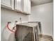 Laundry room with new washer and dryer and modern flooring at 864 E Eldorado Ln, Las Vegas, NV 89123