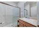 Clean bathroom featuring a glass-enclosed shower and a modern sink at 8786 Sand Verbena Ave, Las Vegas, NV 89117
