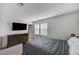 Comfortable bedroom features a dresser and television for relaxing convenience at 8786 Sand Verbena Ave, Las Vegas, NV 89117