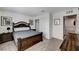 Stylishly furnished bedroom with dark wood bed frame and matching furniture at 8786 Sand Verbena Ave, Las Vegas, NV 89117