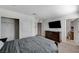 Cozy bedroom showcasing a dresser, closet, and ensuite bathroom at 8786 Sand Verbena Ave, Las Vegas, NV 89117