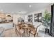 Inviting dining area features a wood table, neutral decor, and flows into the kitchen space at 8786 Sand Verbena Ave, Las Vegas, NV 89117