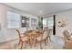 An elegant wood table sits in the dining area with decor art on the walls at 8786 Sand Verbena Ave, Las Vegas, NV 89117