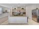 Open concept kitchen with granite countertops, stainless appliances, and seamless access to the living area at 8786 Sand Verbena Ave, Las Vegas, NV 89117