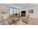 Open living room with comfortable seating, a large TV, and plenty of natural light at 8786 Sand Verbena Ave, Las Vegas, NV 89117
