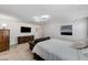 Well-lit main bedroom with dresser and mounted TV for comfort and entertainment at 8786 Sand Verbena Ave, Las Vegas, NV 89117