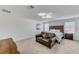 Bright main bedroom with modern ceiling fan, cozy seating area, and serene ambiance for relaxation at 8786 Sand Verbena Ave, Las Vegas, NV 89117