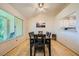 Dining area offers a modern table with seating for six and a large window at 9024 Starmount Dr, Las Vegas, NV 89134