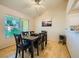 Dining area offers a modern table with seating for six and a large window at 9024 Starmount Dr, Las Vegas, NV 89134