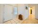 Bright entryway with tile flooring, leading to the bathroom and a hallway with hardwood floors at 9024 Starmount Dr, Las Vegas, NV 89134