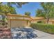 Charming single-story home with a two-car garage, drought-resistant landscaping, and a terracotta tile roof at 9024 Starmount Dr, Las Vegas, NV 89134