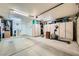 Well-lit garage with storage cabinets, providing organized space for vehicles and hobbies at 9024 Starmount Dr, Las Vegas, NV 89134