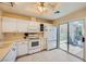 Well-lit kitchen with sliding doors to the backyard and modern appliances at 9024 Starmount Dr, Las Vegas, NV 89134