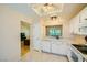 Bright kitchen boasts white cabinets and stainless-steel appliances at 9024 Starmount Dr, Las Vegas, NV 89134