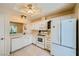 Kitchen features white cabinets and modern appliances at 9024 Starmount Dr, Las Vegas, NV 89134