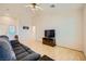 Bright living room features vaulted ceilings and a comfortable sofa at 9024 Starmount Dr, Las Vegas, NV 89134