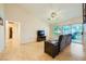 Spacious living room with hardwood floors, vaulted ceilings, and a sliding glass door to the backyard at 9024 Starmount Dr, Las Vegas, NV 89134