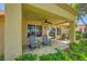Inviting covered patio featuring serene outdoor living with comfortable seating and lush landscaping at 9024 Starmount Dr, Las Vegas, NV 89134