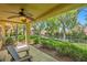 Relaxing covered patio with lush landscaping and comfortable seating, perfect for enjoying the outdoors at 9024 Starmount Dr, Las Vegas, NV 89134