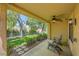 Cozy covered patio offering an outdoor living space with scenic views of the landscaped backyard at 9024 Starmount Dr, Las Vegas, NV 89134