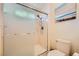 This bathroom features a well lit shower, toilet and shower caddy at 9024 Starmount Dr, Las Vegas, NV 89134