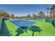 Beautifully maintained blue and green community tennis courts for daytime or evening play at 9024 Starmount Dr, Las Vegas, NV 89134