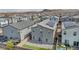 An aerial view of a community with similar style homes, solar panels, and desert landscaping at 9876 Magnus Ct, Las Vegas, NV 89178