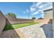 Enclosed backyard featuring artificial turf and a putting green, ideal for relaxing and playing outdoors at 9876 Magnus Ct, Las Vegas, NV 89178