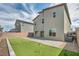 Spacious backyard with artificial turf, brick perimeter, putting green, and a large patio area for entertaining at 9876 Magnus Ct, Las Vegas, NV 89178