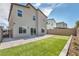 A backyard featuring a patio and artificial turf with mountain views in the distance at 9876 Magnus Ct, Las Vegas, NV 89178