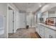 Bright bathroom boasts double sinks, granite counters, and a glass shower with a neutral color palette at 9876 Magnus Ct, Las Vegas, NV 89178