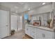 The bathroom includes granite counters, a large vanity, a glass enclosed shower, and ample natural light at 9876 Magnus Ct, Las Vegas, NV 89178