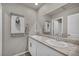 Well-lit bathroom with dual sinks and granite countertops at 9876 Magnus Ct, Las Vegas, NV 89178