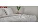 Bedroom with white bedding and a vase at 9876 Magnus Ct, Las Vegas, NV 89178
