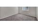 Empty bedroom with a window and soft carpet offering a blank canvas to customize your space at 9876 Magnus Ct, Las Vegas, NV 89178