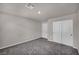Well-lit bedroom with neutral color scheme and closet at 9876 Magnus Ct, Las Vegas, NV 89178