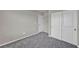 Neutral carpeted bedroom with closet and fresh paint at 9876 Magnus Ct, Las Vegas, NV 89178