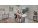 Dining area with table for four, modern decor, and backyard view at 9876 Magnus Ct, Las Vegas, NV 89178