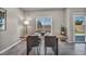 Bright dining area with a modern table setup, natural light, and easy access to the outdoor space at 9876 Magnus Ct, Las Vegas, NV 89178